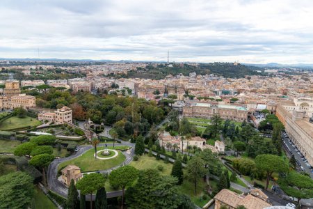 Photo for Roma, Latium - Italy - 11-26-2022: Overlooking the lush Vatican Gardens, this view captures the expansive urban landscape of Rome - Royalty Free Image