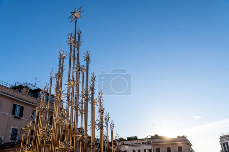 Photo for Roma, Latium - Italy - 11-27-2022: A contemporary star sculpture reaches skyward, adding a festive touch to Rome's cityscape - Royalty Free Image