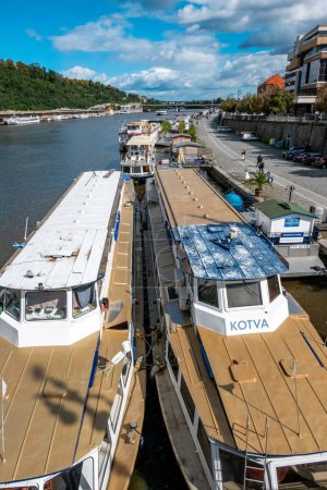 Photo for Prague, Capital City of Prague - Czech Republic - 09-18-2022: Riverboats await passengers on the Vltava River, offering scenic views of Prague - Royalty Free Image
