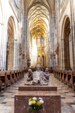 Photo for Prague, Capital City of Prague - Czech Republic - 09-22-2022: A serene perspective inside Prague's cathedral, showcasing the illuminated statue of Saint Adalbert of Prague and stained glass - Royalty Free Image