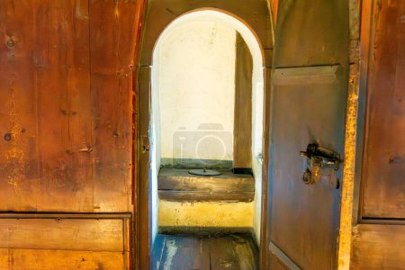 Photo for Salzburg, Salzburg - Austria - 06-17-2021: Historical wooden toilet in Hohensalzburg's Princely Chambers, reflecting medieval sanitary practices - Royalty Free Image