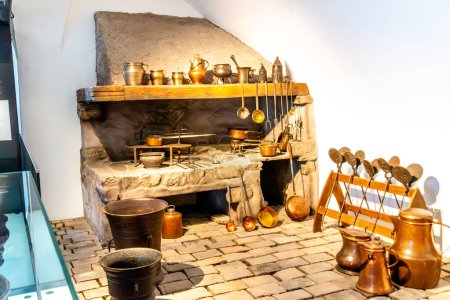 Photo for Salzburg, Salzburg - Austria - 06-17-2021: Traditional kitchen setup with hearth and copper utensils at Hohensalzburg - Royalty Free Image
