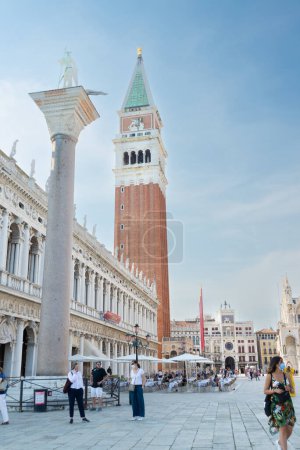 Photo for Venice, Veneto - Italy - 06-09-2021: St. Marks Square with the towering Campanile and the Column of Saint Theodore - Royalty Free Image