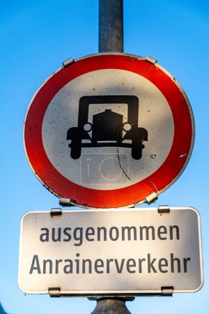 Viehhausen, Salzburg - Austria - 06-16-2021: Weathered Austrian no entry road sign with vintage car icon and caption except local traffic