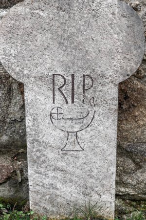 Photo for Bautzen, Saxony - Germany - 04-10-2021: Aged gravestone with 'RIP' and simple chalice sketch, symbolizing remembrance - Royalty Free Image