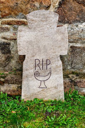 Photo for Bautzen, Saxony - Germany - 04-10-2021: Aged gravestone with 'RIP' and simple chalice sketch, symbolizing remembrance - Royalty Free Image