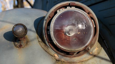 The headlight of an old Soviet car. Car detail. close-up