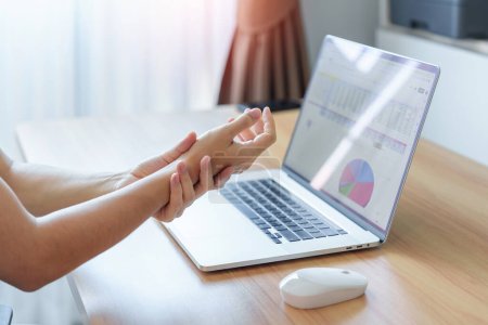 Woman having wrist pain when using mouse during working long time on workplace. De Quervain s tenosynovitis, ergonomic, Carpal Tunnel Syndrome or Office syndrome concept