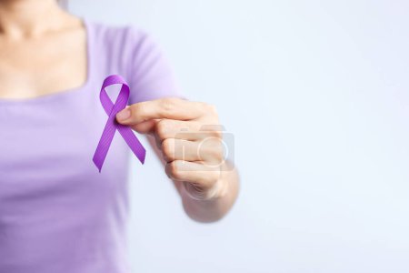 Photo for Purple ribbon for cancer day, lupus, Pancreatic, Esophageal, Testicular cancer, world Alzheimer, epilepsy, Sarcoidosis, Fibromyalgia and domestic violence Awareness month concepts - Royalty Free Image