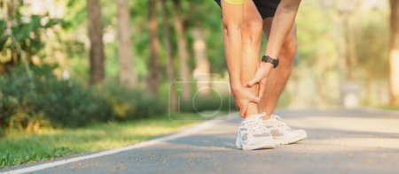 Photo for Young adult male with his muscle pain during running. runner man having leg ache due to Shin Splints. Sports injuries and medical concept - Royalty Free Image