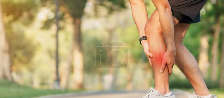 Photo for Young adult man with his muscle pain during running. runner man having leg ache due to Calf muscle pull. Sports injuries and medical concept - Royalty Free Image