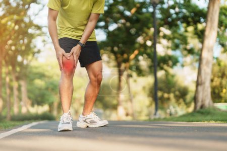 Photo for Young adult male with muscle pain during running. runner have knee ache due to Runners Knee or Patellofemoral Pain Syndrome, osteoarthritis and Patellar Tendinitis. Sports injuries and medical concept - Royalty Free Image