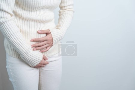 Photo for Woman having Stomach pain. Ovarian and Cervical cancer, Cervix disorder, Endometriosis, Hysterectomy, Uterine fibroids, Reproductive system, menstruation, diarrhea and Pregnancy concept - Royalty Free Image