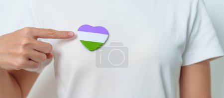 Photo for Queer Pride Day and LGBT pride month concept. purple, white and green heart shape for Lesbian, Gay, Bisexual, Transgender, genderqueer and Pansexual community - Royalty Free Image