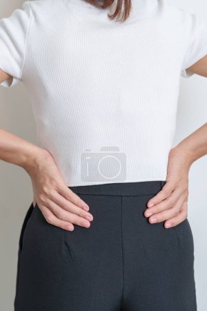Photo for Woman having back pain. Urinary system and Stones, Cancer, world kidney day, Chronic kidney stomach, liver pain and pancreas concept - Royalty Free Image