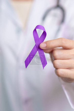 Photo for Purple Ribbon for Violence, Pancreatic, Esophageal, Testicular cancer, Alzheimer, epilepsy, lupus, Sarcoidosis and Fibromyalgia. Awareness month and World cancer day concept - Royalty Free Image