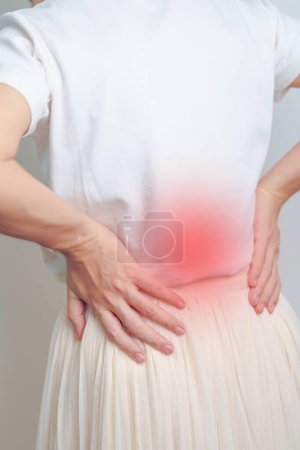 Photo for Woman having back pain. Urinary system and Stones, Kidney Cancer, world kidney day, Chronic kidney stomach, liver pain and pancreas concept - Royalty Free Image