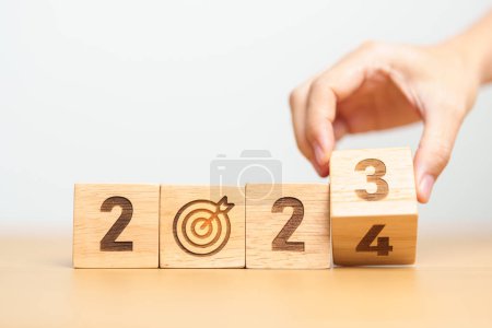 Photo for 2023 year change to 2024 year block with dartboard icon. Goal, Target, Resolution, strategy, plan, Action, mission, motivation, and New Year start concepts - Royalty Free Image