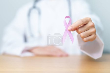 Photo for Doctor holding Purple Ribbon for Stomach, Violence, Pancreatic, Esophageal, Testicular cancer, Alzheimer, epilepsy, lupus, Sarcoidosis and Fibromyalgia. Awareness month and World cancer day concept - Royalty Free Image