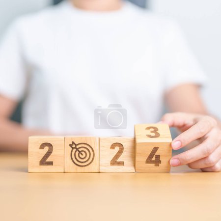 Photo for 2023 year change to 2024 year block with dartboard icon. Goal, Target, Resolution, strategy, plan, Action, mission, motivation, and New Year start concepts - Royalty Free Image