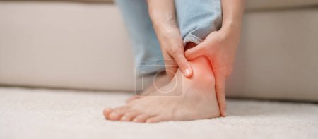 Photo for Woman having leg pain due to Ankle Sprains or Achilles Tendonitis and Shin Splints ache. injuries, health and medical concept - Royalty Free Image