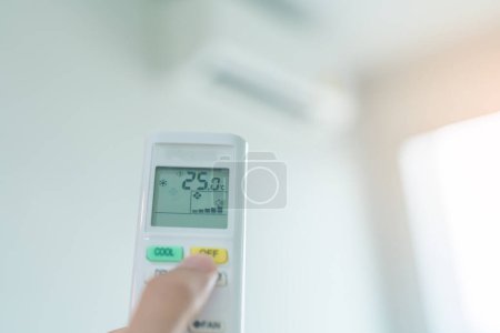 hand operating remote controller for adjust Air conditioner inside the room of office or house