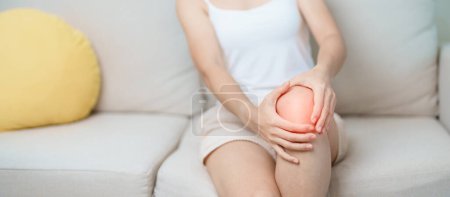 Photo for Woman having knee ache and muscle pain due to Runners Knee or Patellofemoral Pain Syndrome, osteoarthritis, arthritis, rheumatism and Patellar Tendinitis. medical concept - Royalty Free Image