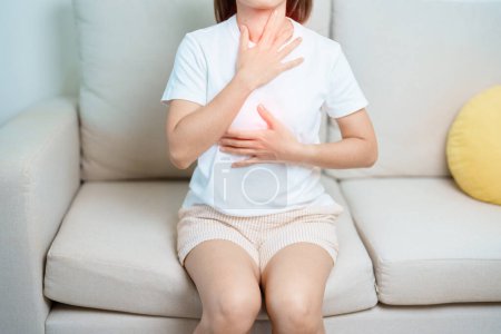 Gastroesophageal Reflux Disease or GERD, Acid reflux disease, Gastro Oesophageal or GORD and Dyspepsia concept. woman having Stomach ache and Esophageal pain due to Digestion system problem