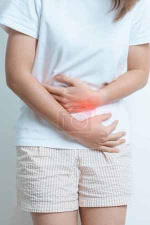 Woman having Stomach pain. Ovarian and Cervical cancer, Cervix disorder, Endometriosis, Hysterectomy, Uterine fibroids, Reproductive system, menstruation, diarrhea and Pregnancy concept