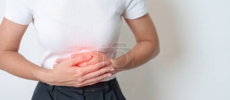 Woman having Stomach pain. Ovarian and Cervical cancer, Cervix disorder, Endometriosis, Hysterectomy, Uterine fibroids, Reproductive system, menstruation, diarrhea, digestive system and Pregnancy
