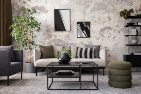 Photo for Creative composition of concrete living room with mock up poster frame, stylish grey sofa, green pillow, simple black coffee table, plants in flowerpot and personal accessories. Home decor. Template. - Royalty Free Image