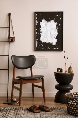 Téléchargez les photos : Classic interior of kitchen space with mock up poster frame, round coffee table, stylish chair, slippers, gray rug, basket, ladder and personal accessories. Home decor. Template. - en image libre de droit
