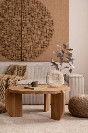 Aesthetic composition of living room interior with mock up poster,  modular beige sofa, round coffee table, rug, pouf, bowl, vase with rowan, books and personal accessories. Home decor. Template.