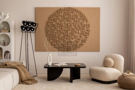 Téléchargez les photos : Interior design of living room with mock up poster frame, modern black coffee table, beige sofa, vase with rowan, rounded shapes armchair, pouf. lamp and personal accessories. Home decor. Template. - en image libre de droit