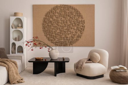 Téléchargez les photos : Aesthetic composition of japandi living room interior with mock up poster frame, modern black coffee table, vase with rowan, rounded shapes armchair and personal accessories. Home decor. Template. - en image libre de droit