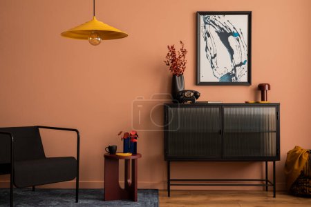 Foto de Interior design of cozy living room with mock up poster frame, glass sideboard, yellow lamp, plaid, carpet, black armchair, vase with dried flowers and personal accessories. Home decor. Template. - Imagen libre de derechos