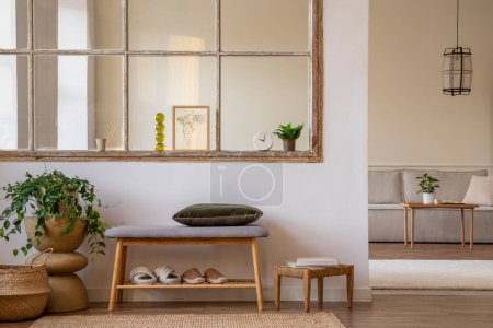 Téléchargez les photos : Minimalist composition of open space interior with mock up poster, bench, green pillow, plants, wooden coffee table, boho stool, window, modular sofa and personal accessories. Home decor. Template. - en image libre de droit