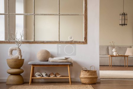 Téléchargez les photos : Minimalist composition of open space interior with bench, round pillow, slippers, wooden coffee table, window, vase with dried flowers, modular sofa and personal accessories. Home decor. Template. - en image libre de droit