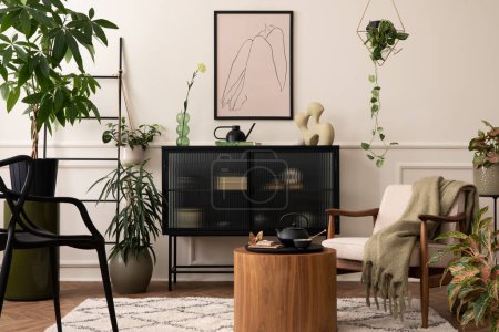 Photo for Interior design of living room interior with mock up poster frame, black sideboard, round coffee table, plants in flowerpots. armchair with green plaid and personal accessories. Home decor. Template. - Royalty Free Image