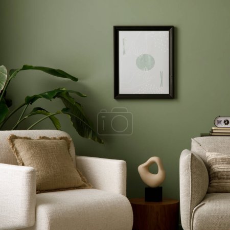 Téléchargez les photos : Stylish composition of living room interior with green wall, sofa with pillow and plaid. White armchair with pillow, wooden coffee table with vase with leaves glass ball. Vase with flower. Template. - en image libre de droit