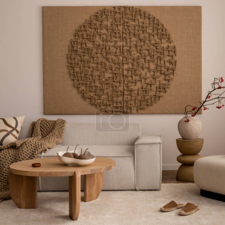 Photo for Living room interior with mock up poster frame, beige sofa, round wooden coffee table, rug, pouf, vase with rowan, rounded shapes armchair, braided plaid and personal accessories. Home decor. Template - Royalty Free Image