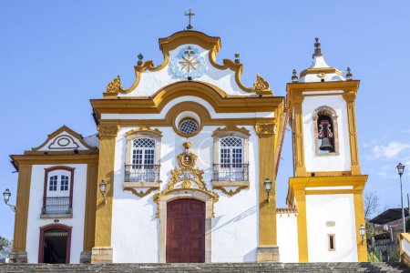 Photo for Facade of the beautiful baroque church of Nossa Senhora das Merces in the historic center of Sao Joao del Rei, under blue sky. - Royalty Free Image