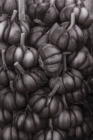 Garlic on display at a street market stall in Sao Paulo, Brazil. Black and white photo