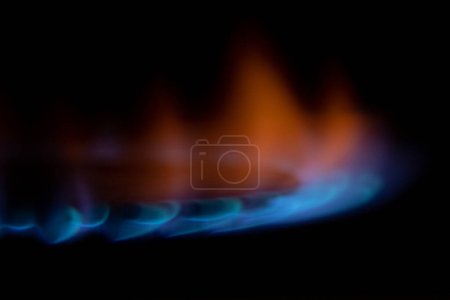 Photo for Gas burns in the dark close-up, gas stove in the dark - Royalty Free Image