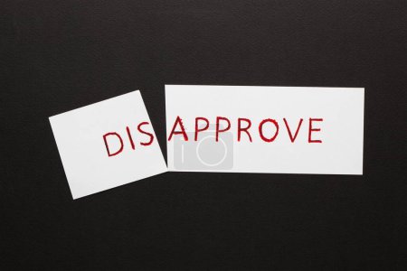 Changing word disapprove transformed to approve on a white sheet. Business concept.