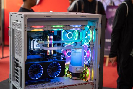 Foto de Shot of overclocked CPU computer cabinet with water liquid cooled processors and RGB red green blue lighting with metal pipes running India - Imagen libre de derechos
