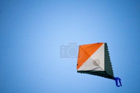 Photo for Colorful kite flying on makar sankranti independence republic day with indias tricolor flag showing the celebration - Royalty Free Image