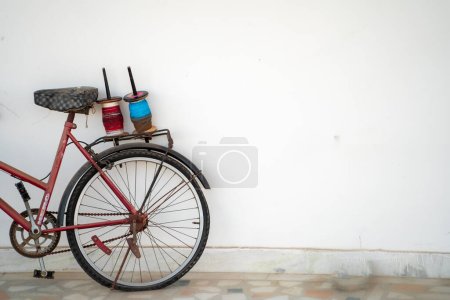 Photo for Bicycle with kite flying thread spools charkhi on the carrier showing the celebrations of this festival in rajasthan gujarat delhi india with copy space - Royalty Free Image