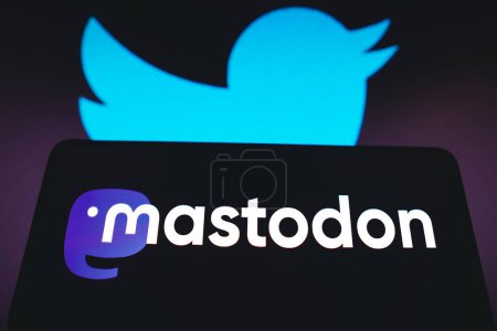 Photo for November 12, 2022, Brazil. In this photo illustration, the social media platform, Mastodon logo seen displayed on a smartphone with the Twitter logo in the background - Royalty Free Image