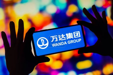 Photo for December 12, 2022, Brazil. In this photo illustration, the Wanda Group (Dalian Wanda) logo is displayed on a smartphone mobile screen - Royalty Free Image